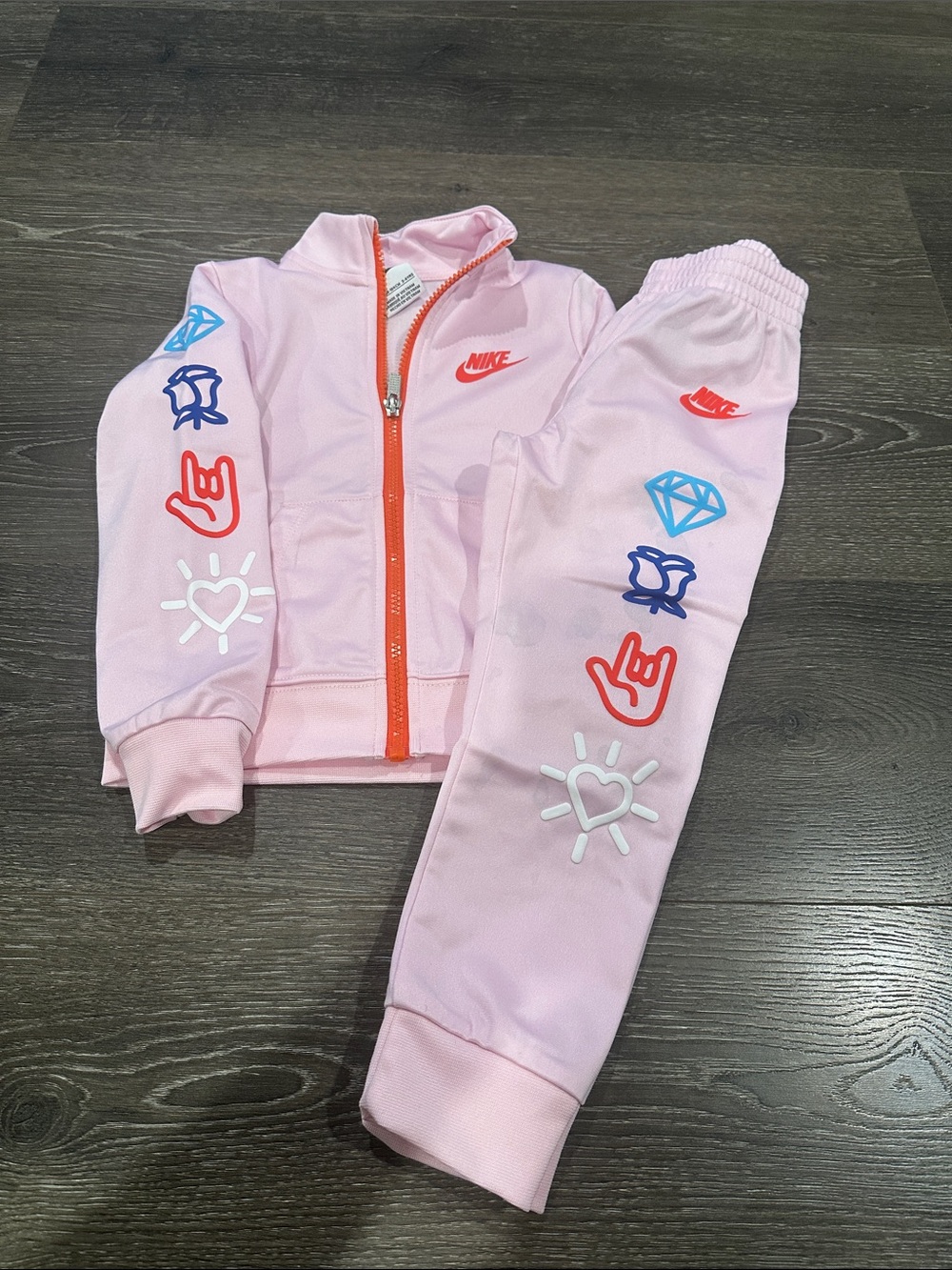 Nike Kids Light Pink Jogger Set with Bright Graphic Accents